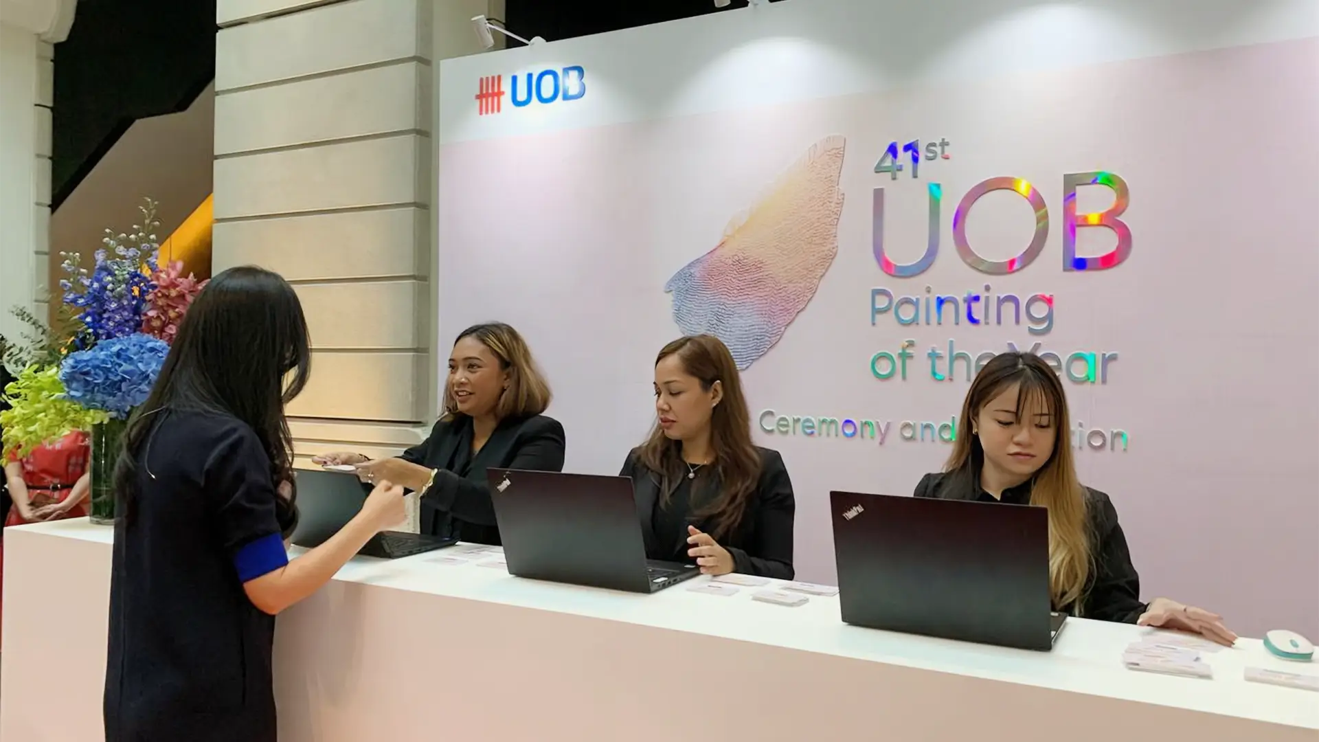 Walk-in attendee arriving at an event registration desk